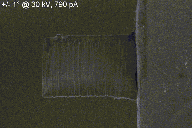 **Black-and-white interior with geometric blocks and a small X on a panel.**